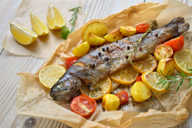 Fish with vegetables in cooking paper