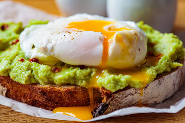 Wholemeal bread with avocado cream and eggs